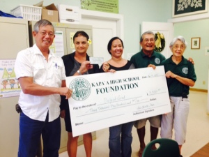 Class of 1966 representative Lincoln Ching along with Foundation Board members Shellie Domingsil, Art Fujita, and Barbara Yamane present check to Project Grad chair Kaleo Kelipuleole