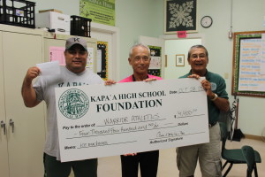 Principal Danny Hamada and Coach Calvin Paleka accept check to purchase two new ice machines for Athletic Department